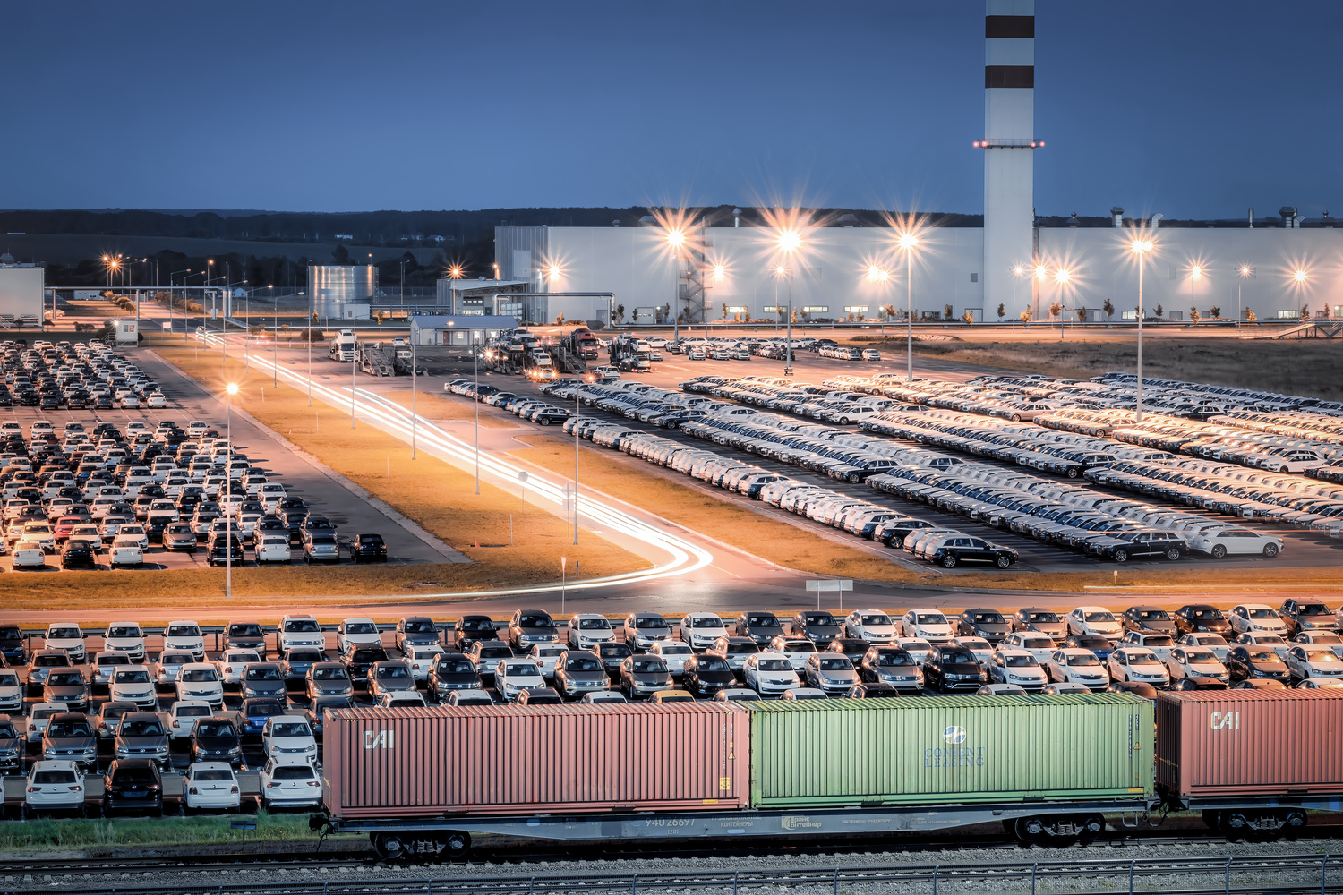 New Cars Parked at a Distribution Center at Night